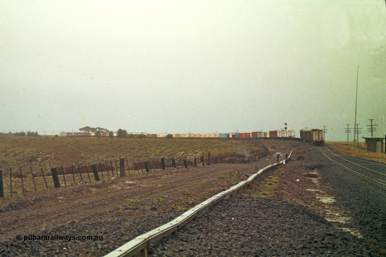 113-17
Bank Box Loop, V/Line train 9150, up Adelaide goods, in miserable conditions, poor quality, distant shot departed.
