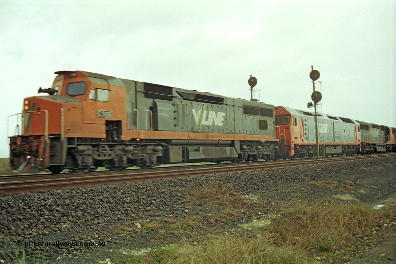 113-19
Parwan Loop, V/Line broad gauge up Adelaide goods train 9150 with C class C 506 Clyde Engineering EMD model GT26C serial 76-829, G class G 538 Clyde Engineering EMD model JT26C-2SS serial 89-1271 and C class C 510 serial 76-833 split the up home signals at the west end of the loop, in miserable conditions, poor quality.
Keywords: C-class;C506;Clyde-Engineering-Rosewater-SA;EMD;GT26C;76-829;