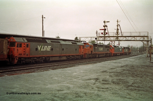 113-03
Ballarat station platform No.2, signal gantry with stripped doll, V/Line broad gauge up Adelaide goods train 9150 behind the quad CGCG combo of C class C 506 Clyde Engineering EMD model GT26C serial 76-829, G class G 538 Clyde Engineering EMD model JT26C-2SS serial 89-1271, C class C 510 serial 76-833 and G class G 513 serial 85-1241, in miserable conditions, poor quality.
Keywords: G-class;G513;Clyde-Engineering-Rosewater-SA;EMD;JT26C-2SS;85-1241;