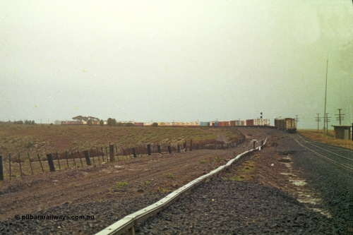 113-17
Bank Box Loop, V/Line train 9150, up Adelaide goods, in miserable conditions, poor quality, distant shot departed.

