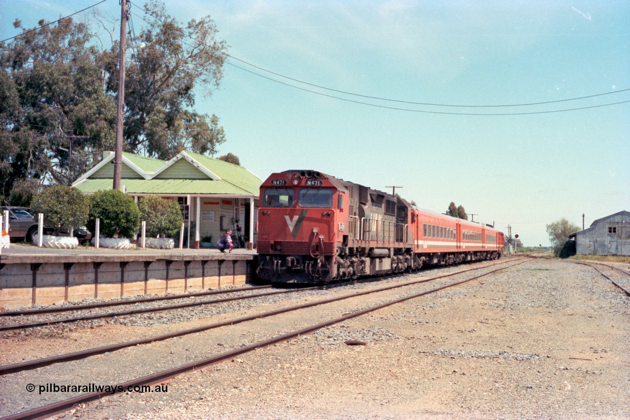 114-02
Cobram, V/Line broad gauge N class N 471 'City of Benalla' Clyde Engineering EMD model JT22HC-2 serial 87-1200, N set N 3, D van, down passenger train arriving at station, yard view.
Keywords: N-class;N471;Clyde-Engineering-Somerton-Victoria;EMD;JT22HC-2;87-1200;