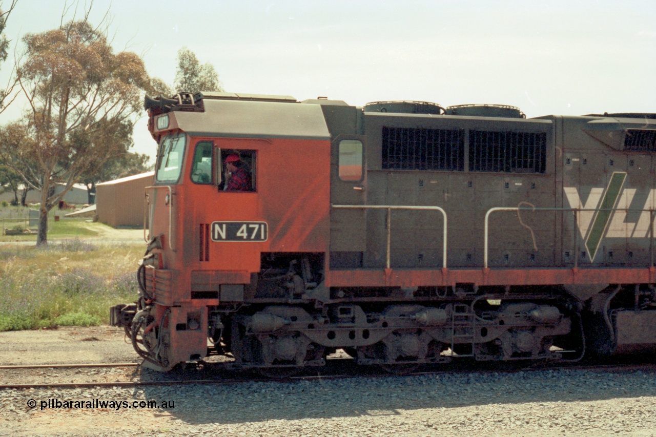 114-12
Cobram, V/Line broad gauge N class N 471 'City of Benalla' Clyde Engineering EMD model JT22HC-2 serial 87-1200, cab side view.
Keywords: N-class;N471;Clyde-Engineering-Somerton-Victoria;EMD;JT22HC-2;87-1200;