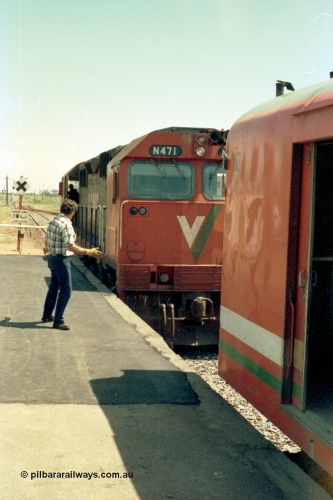 114-13
Cobram, V/Line broad gauge N class N 471 'City of Benalla' Clyde Engineering EMD model JT22HC-2 serial 87-1200, attaching to pass cars, 2nd person signalling.
Keywords: N-class;N471;Clyde-Engineering-Somerton-Victoria;EMD;JT22HC-2;87-1200;