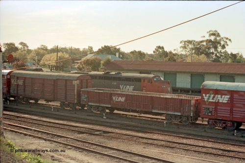 114-23
Benalla station yard, elevated view of V/Line S class S 300 'Matthew Flinders' Clyde Engineering EMD model A7 serial 57-164, VOFX type bogie open waggon VOFX 242 which was built by Victorian Railways Bendigo Workshops in April 1969 as an ELX type, recoded to VOFX in 1987.
Keywords: S-class;S300;Clyde-Engineering-Granville-NSW;EMD;A7;57-164;bulldog;VOFX-type;VOFX242;