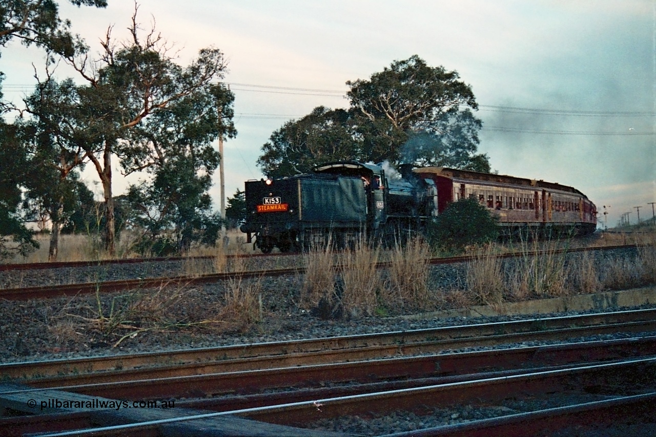 115-14
Somerton, Steamrail broad gauge K class K 153 Victorian Railways built Consolidation model 2-8-0 steam locomotive rounds the curve on the Upfield line with an up enthusiasts special running into Somerton to run around, standard gauge line to Ford's Siding in the middle, Steamrail special, looking across the North East running lines.
Keywords: K-class;K153;Victorian-Railways-Newport-WS;Consolidation;2-8-0;