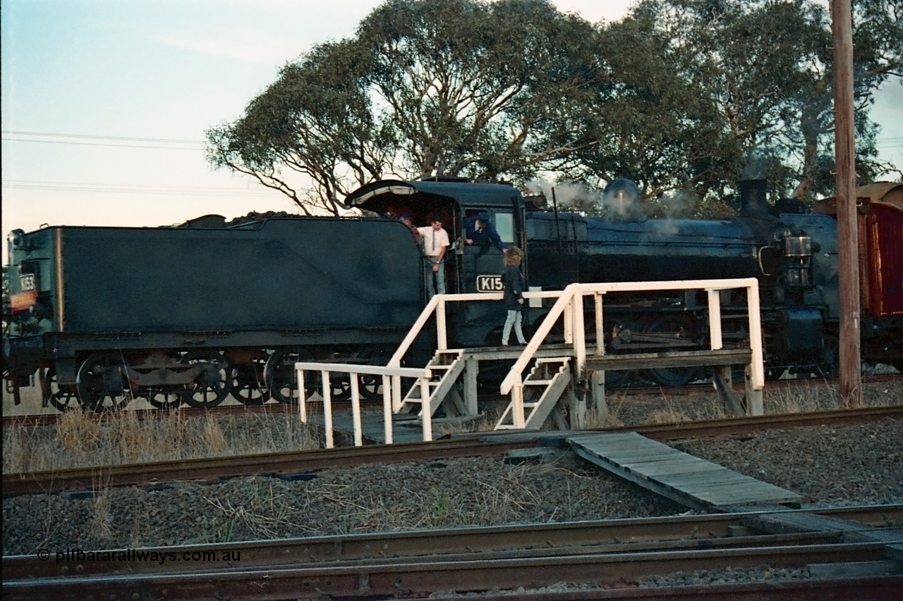 115-15
Somerton, Steamrail broad gauge K class K 153 Victorian Railways built Consolidation model 2-8-0 steam locomotive on the Upfield line surrenders the ordinary train staff to the female signaller with an enthusiasts special, near platform is for the standard gauge line, staff exchange, Steamrail special, looking across the North East running lines.
Keywords: K-class;K153;Victorian-Railways-Newport-WS;Consolidation;2-8-0;