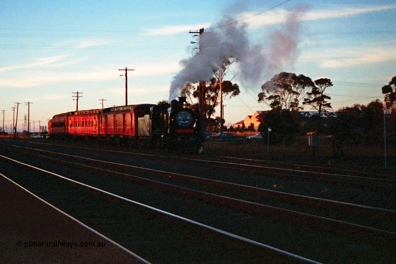 115-18
Somerton, Steamrail broad gauge K class K 153 Victorian Railways built Consolidation model 2-8-0 steam locomotive with an enthusiasts special runs across Greenvale Road on its way back to Melbourne, the main North East broad and standard gauge lines running through the middle of the frame, taken from out the front of the signal box.
Keywords: K-class;K153;Victorian-Railways-Newport-WS;Consolidation;2-8-0;