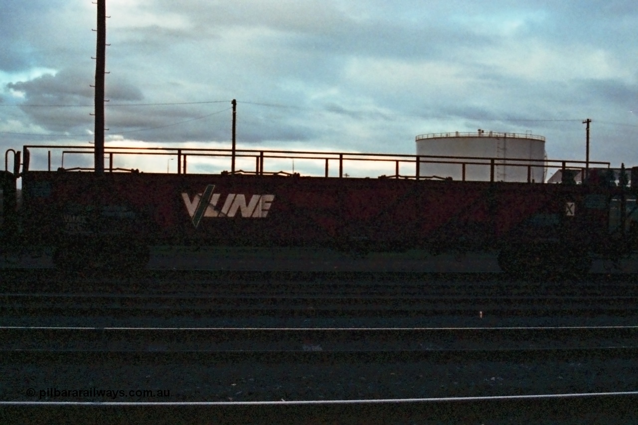 115-26
Somerton, V/Line broad gauge VMAX type bogie car carrying waggon VMAX 19, originally built from scrapped carriage underframes in May 1961 as an AA type, recoded to AF type in late 1961, then AX in 1964 and recoded in 1979 to VMAX.
Keywords: VMAX-type;VMAX19;AA-type;