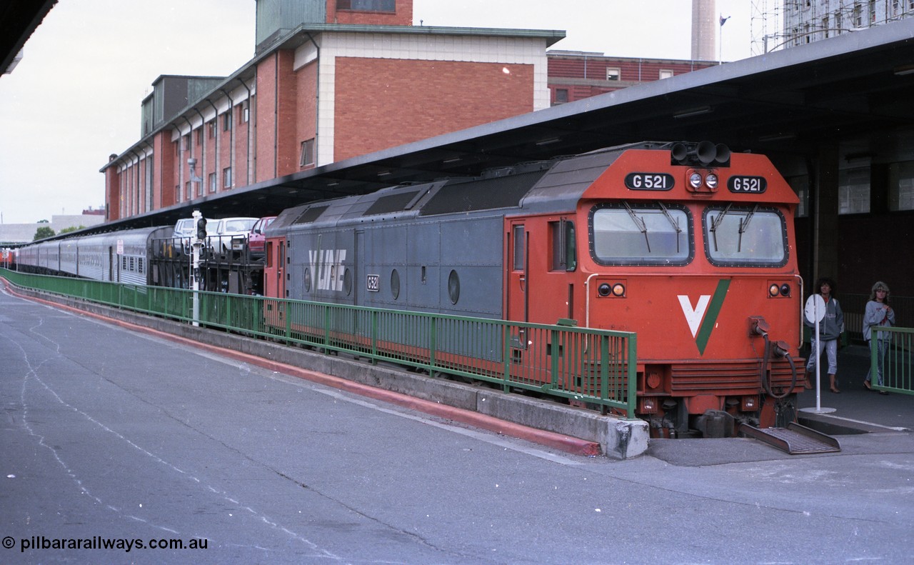 116-01
Spencer Street Station Platform No.1, V/Line standard gauge G class G 521 Clyde Engineering EMD model JT26C-2SS serial 85-1234 has arrived in Melbourne with the overnight train from Sydney, by the look of those hair styles it would have to be the very early 1990s!
Keywords: G-class;G521;Clyde-Engineering-Rosewater-SA;EMD;JT26C-2SS;85-1234;