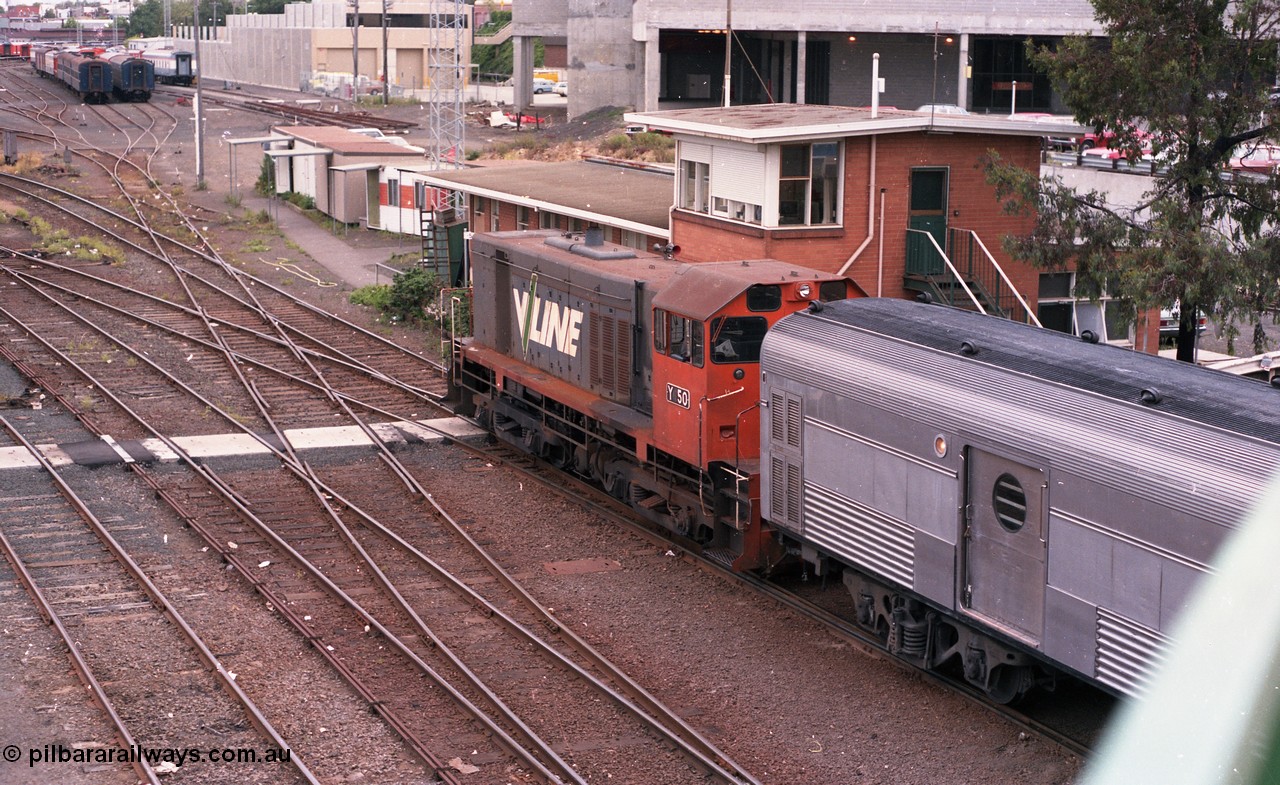 116-03
Spencer Street Station, view looking south from flyover with Motorail waggon on 'The Overland' at platform No.2, with stabled diesel electric rail motors, or DERMs 55 RM and 54 RM, with H set SH 29, overlooking the Melbourne Yard, West Tower is visible to the right.
