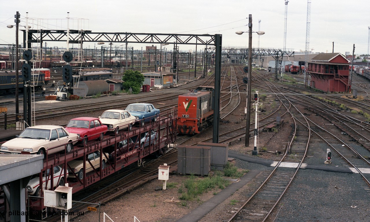 116-09
Spencer Street Station, view looking west from flyover, V/Line broad gauge Y class pilot Y 151 Clyde Engineering EMD model G6B serial 67-571 runs towards platform No.2 to collect the 'The Overland' Motorail waggons, DERMs 55 RM and 54 RM at left, West Tower in the middle background, Spencer Street No.1 Signal Box at right with broad gauge passenger stabling and maintenance sidings behind it, track work, points, searchlight signals and gantries and shunting signals.
Keywords: Y-class;Y151;67-571;Clyde-Engineering-Granville-NSW;EMD;G6B;