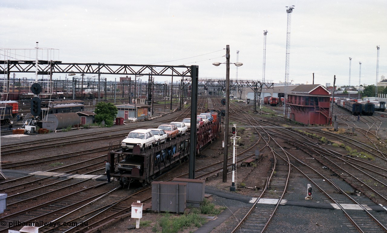 116-11
Spencer Street Station, view looking west from flyover, V/Line broad gauge Y class pilot Y 151 Clyde Engineering EMD model G6B serial 67-571 shunts the 'The Overland' Motorail waggons, DERM 54 RM at left, West Tower in the middle background, Spencer Street No.1 Signal Box at right with broad gauge passenger stabling and maintenance sidings behind it, track work, points, searchlight signals and gantries and shunting signals, shunter riding waggon.
Keywords: Y-class;Y151;67-571;Clyde-Engineering-Granville-NSW;EMD;G6B;