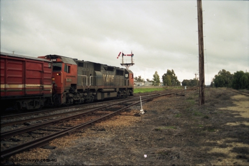 117-12
Springhurst, V/Line N class N 466 'City of Warrnambool' Clyde Engineering EMD model JT22HC-2 serial 86-1195 departs Springhurst with an up Albury passenger train, trailing shot, semaphore signal post 4 pulled off for move, points, point lever, yard view.
Keywords: N-class;N466;Clyde-Engineering-Somerton-Victoria;EMD;JT22HC-2;86-1195;