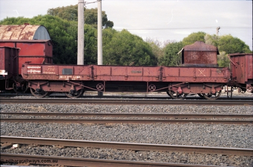 117-13
Benalla, stored broad gauge waggons, VHNA type bogie ballast waggon with plate frame bogies VHNA 72, stencilled 'Held for ARHS'. Built by Newport Workshops in June 1913 at QN type, in February 1981 recoded to VHNA type and placed off register in May 1984. 
Keywords: VHNA-type;VHNA72;Victorian-Railways-Newport-WS;QN-type;