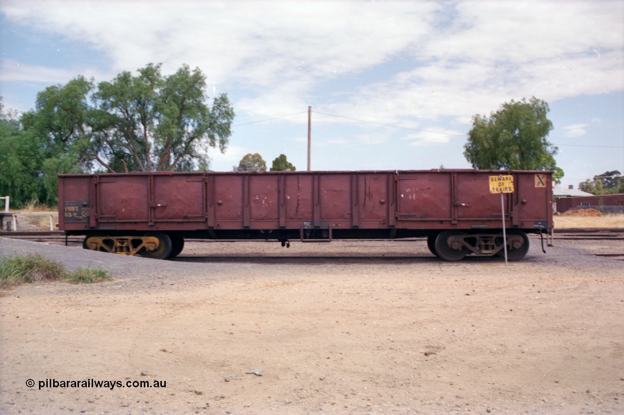 118-06
Strathmerton yard, V/Line broad gauge VOBX type bogie open waggon VOBX 68, side shot, built by Victorian Railways Newport Workshops as ELF type 1963, to ELX 1965, then VOBX in 1979 and to ROBX in 1994.
Keywords: VOBX-type;VOBX68;Victorian-Railways-Newport-WS;ELF-type;ELX-type;ROBX-type;