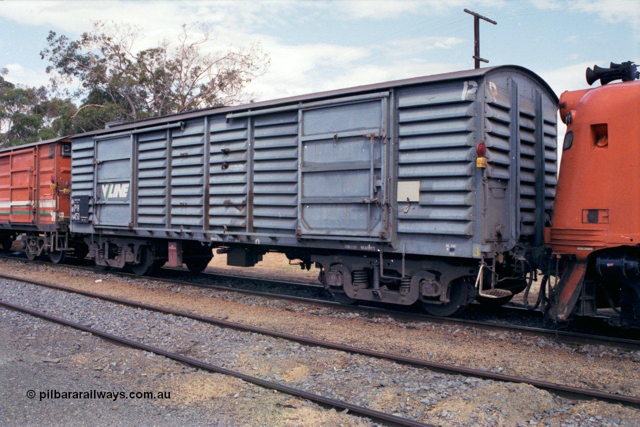 118-20
Cobram, V/Line broad gauge PH type bogie power van PH 451, V/Line grey livery, stabled up passenger train. Built in April 1956 by Newport Workshops as VP type van VP 139, re-coded in February 1980 to VLPY type, in August 1984 at Newport Workshops converted to PH 451 by replacing roof and fitting of generator sets.
Keywords: PH-type;PH451;Victorian-Railways-Newport-WS;VP-type;VP139;VLPY-type