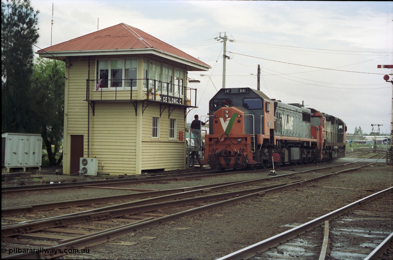 119-04
Nth Geelong C Box, V/Line broad gauge light locos X class X 47 Clyde Engineering EMD model G26C serial 75-794 and N class N 461 'City of Ararat' Clyde Engineering EMD model JT22HC-2 serial 86-1190 collect the electric staff for the Nth Geelong B Box section, bound for Geelong loco depot after finishing grain loop unloading duties.
Keywords: X-class;X47;Clyde-Engineering-Rosewater-SA;EMD;G26C;75-794;