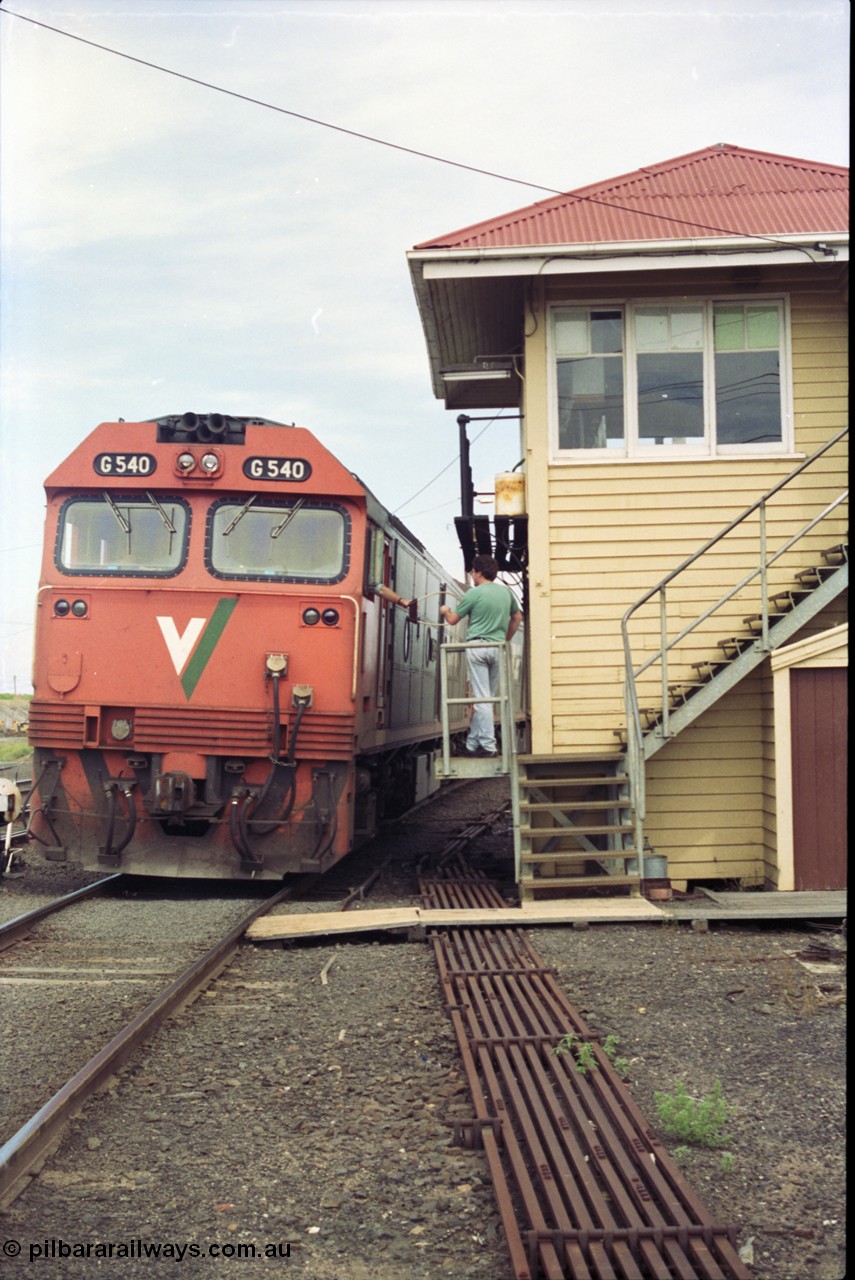 119-07
Nth Geelong C Box, V/Line broad gauge light engines G class G 540 Clyde Engineering EMD model JT26C-2SS serial 89-1273 handing up the electric staff from Nth Geelong B, safeworking, point rodding, signal box.
Keywords: G-class;G540;Clyde-Engineering-Somerton-Victoria;EMD;JT26C-2SS;89-1273;