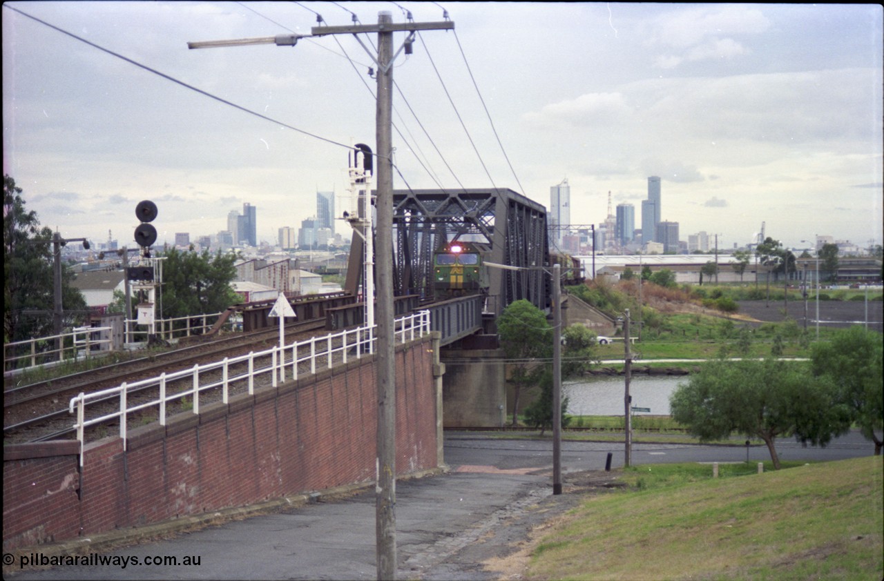 119-13
Maribyrnong River, Bunbury St Tunnel, Australian National broad gauge loco BL class BL 31 Clyde Engineering EMD model JT26C-2SS serial 83-1015 and V/Line C class C 509 Clyde Engineering EMD model GT26C serial 76-832 work down Adelaide goods train 9149 over the Maribyrnong River.
Keywords: BL-class;BL31;83-1015;Clyde-Engineering-Rosewater-SA;EMD;JT26C-2SS;