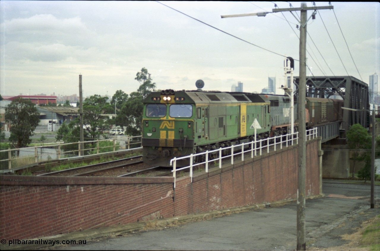 119-14
Maribyrnong River, Bunbury St Tunnel, Australian National broad gauge loco BL class BL 31 Clyde Engineering EMD model JT26C-2SS serial 83-1015 and V/Line C class C 509 Clyde Engineering EMD model GT26C serial 76-832 work down Adelaide goods train 9149 over the Maribyrnong River.
Keywords: BL-class;BL31;Clyde-Engineering-Rosewater-SA;EMD;JT26C-2SS;83-1015;