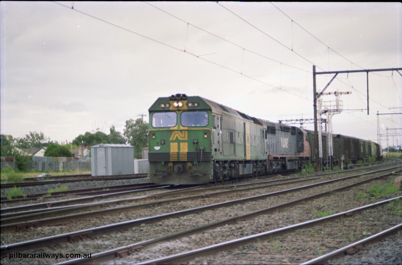 119-18
Sunshine, Australian National broad gauge loco BL class BL 31 Clyde Engineering EMD model JT26C-2SS serial 83-1015 and V/Line C class C 509 Clyde Engineering EMD model GT26C serial 76-832 with down Adelaide goods train 9149, on the Independent Goods Lines, about to cross passenger lines, semaphore signal post 31.
Keywords: BL-class;BL31;83-1015;Clyde-Engineering-Rosewater-SA;EMD;JT26C-2SS;