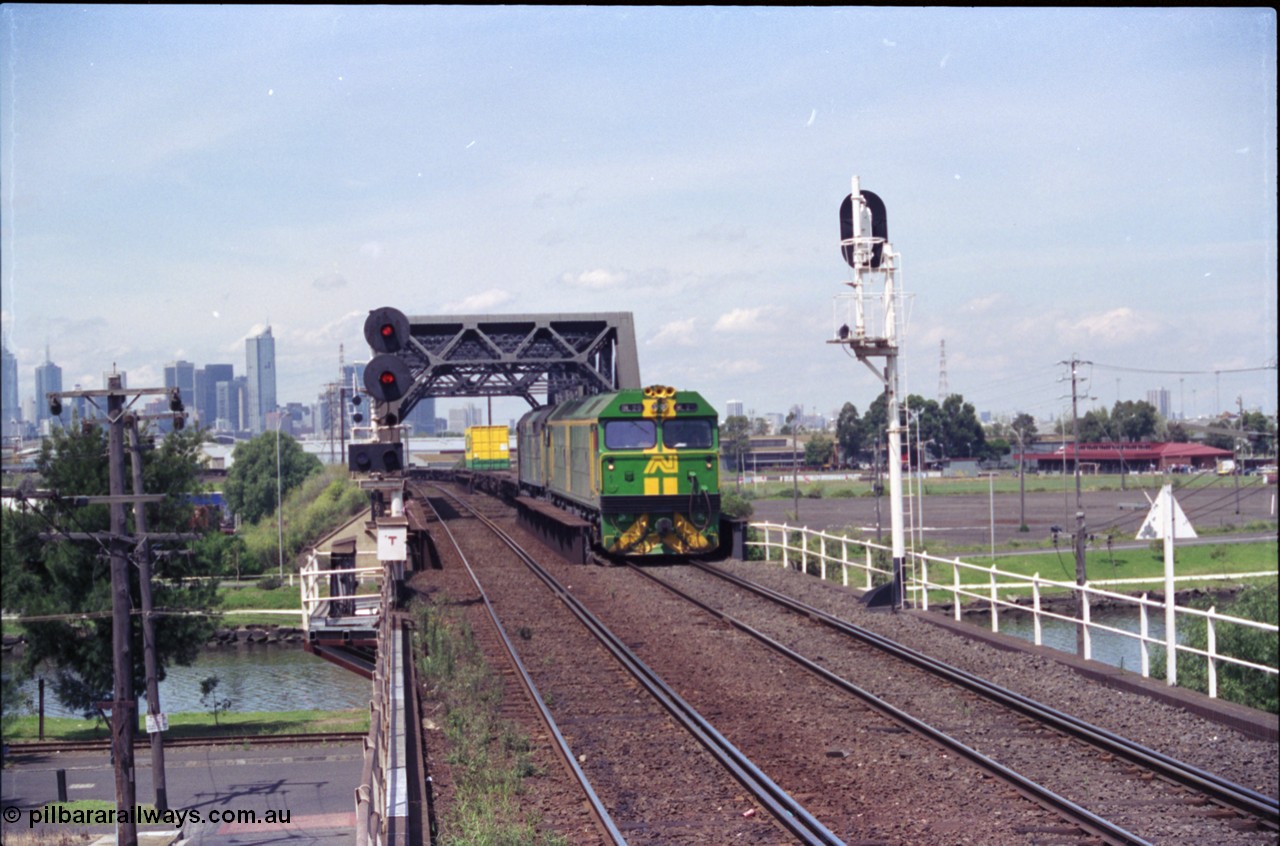 119-22
Maribyrnong River bridge, signal post 162, Australian National broad gauge locos BL class BL 29 Clyde Engineering EMD model JT26C-2SS serial 83-1013 and 700 class 703 AE Goodwin ALCo model DL500G serial G6059-1 working down Adelaide bound goods train 9145 across the river.
Keywords: BL-class;BL29;Clyde-Engineering-Rosewater-SA;EMD;JT26C-2SS;83-1013;