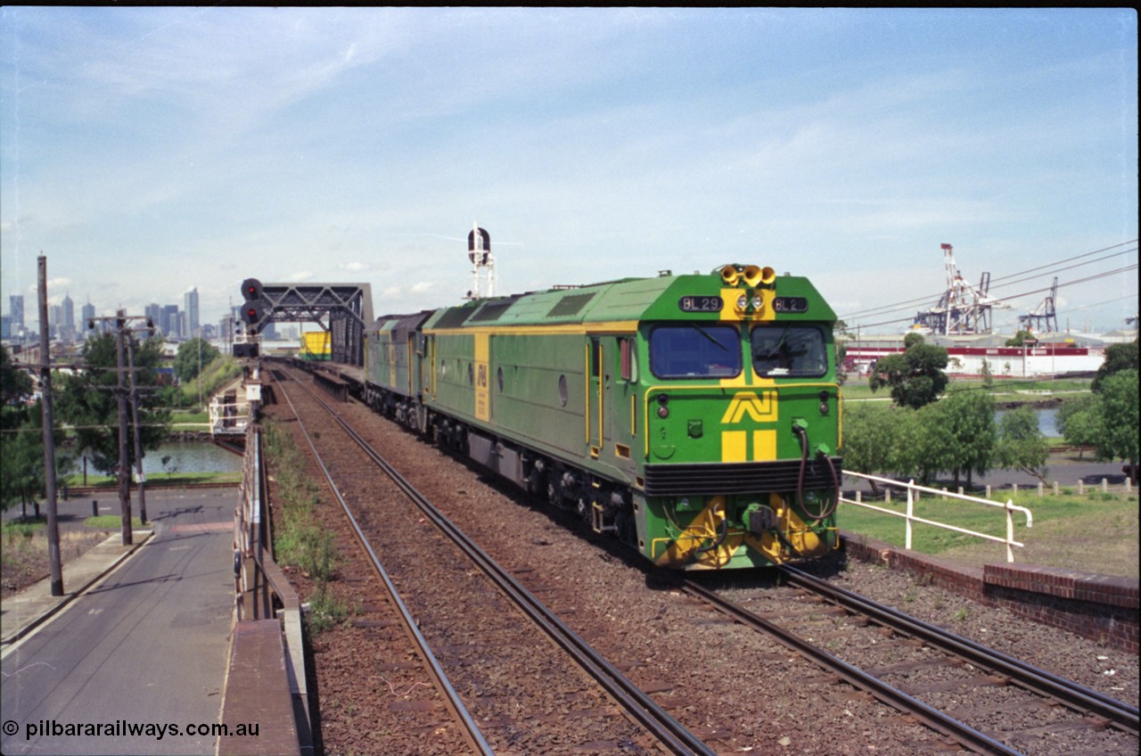 119-23
Maribyrnong River bridge, signal post 162, Australian National broad gauge locos BL class BL 29 Clyde Engineering EMD model JT26C-2SS serial 83-1013 and 700 class 703 AE Goodwin ALCo model DL500G serial G6059-1 working down Adelaide bound goods train 9145 across the river.
Keywords: BL-class;BL29;83-1013;Clyde-Engineering-Rosewater-SA;EMD;JT26C-2SS;