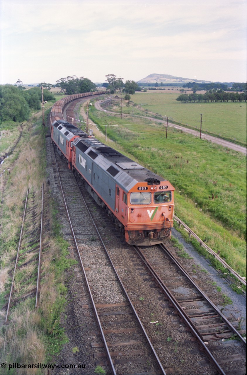 119-35
Warrenheip, V/Line broad gauge G class locos G 513 Clyde Engineering EMD model JT26C-2SS serial 85-1241 with another G class working down empty grain train 9125, swings onto the down mainline, taken from signal post 5, remains of removed Siding C, semaphore signal post 2 and disc signal post 3.
Keywords: G-class;G513;Clyde-Engineering-Rosewater-SA;EMD;JT26C-2SS;85-1241;