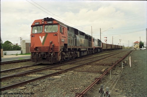 119-02
Nth Geelong C Box, V/Line broad gauge locos N class N 461 'City of Ararat' Clyde Engineering EMD model JT22HC-2 serial 86-1190 and X class X 47 Clyde Engineering EMD model G26C serial 75-794 work an empty grain train onto the mainline to Gheringhap from the Nth Geelong grain loop, crossing Separation Street, semaphore signals, point rodding and signal box.
Keywords: N-class;N461;Clyde-Engineering-Somerton-Victoria;EMD;JT22HC-2;86-1190;