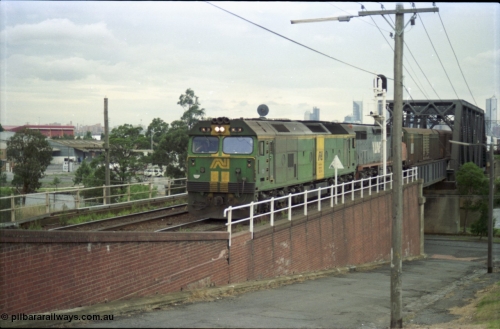119-14
Maribyrnong River, Bunbury St Tunnel, Australian National broad gauge loco BL class BL 31 Clyde Engineering EMD model JT26C-2SS serial 83-1015 and V/Line C class C 509 Clyde Engineering EMD model GT26C serial 76-832 work down Adelaide goods train 9149 over the Maribyrnong River.
Keywords: BL-class;BL31;Clyde-Engineering-Rosewater-SA;EMD;JT26C-2SS;83-1015;