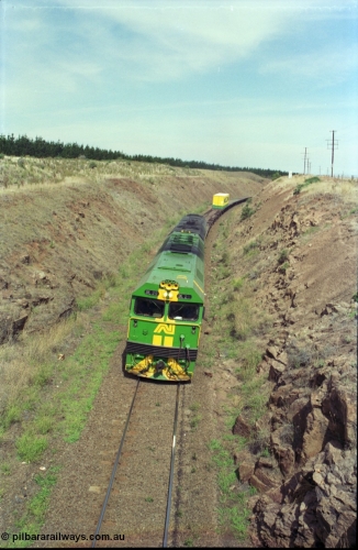 119-32
Islington Bank, Dog Trap Gully Road bridge, Australian National broad gauge locos BL class BL 29 Clyde Engineering EMD model JT26C-2SS serial 83-1013 and 700 class 703 AE Goodwin ALCo model DL500G serial G6059-1 with down Adelaide goods train 9145, climbing Islington Bank, elevated view.
Keywords: BL-class;BL29;Clyde-Engineering-Rosewater-SA;EMD;JT26C-2SS;83-1013;