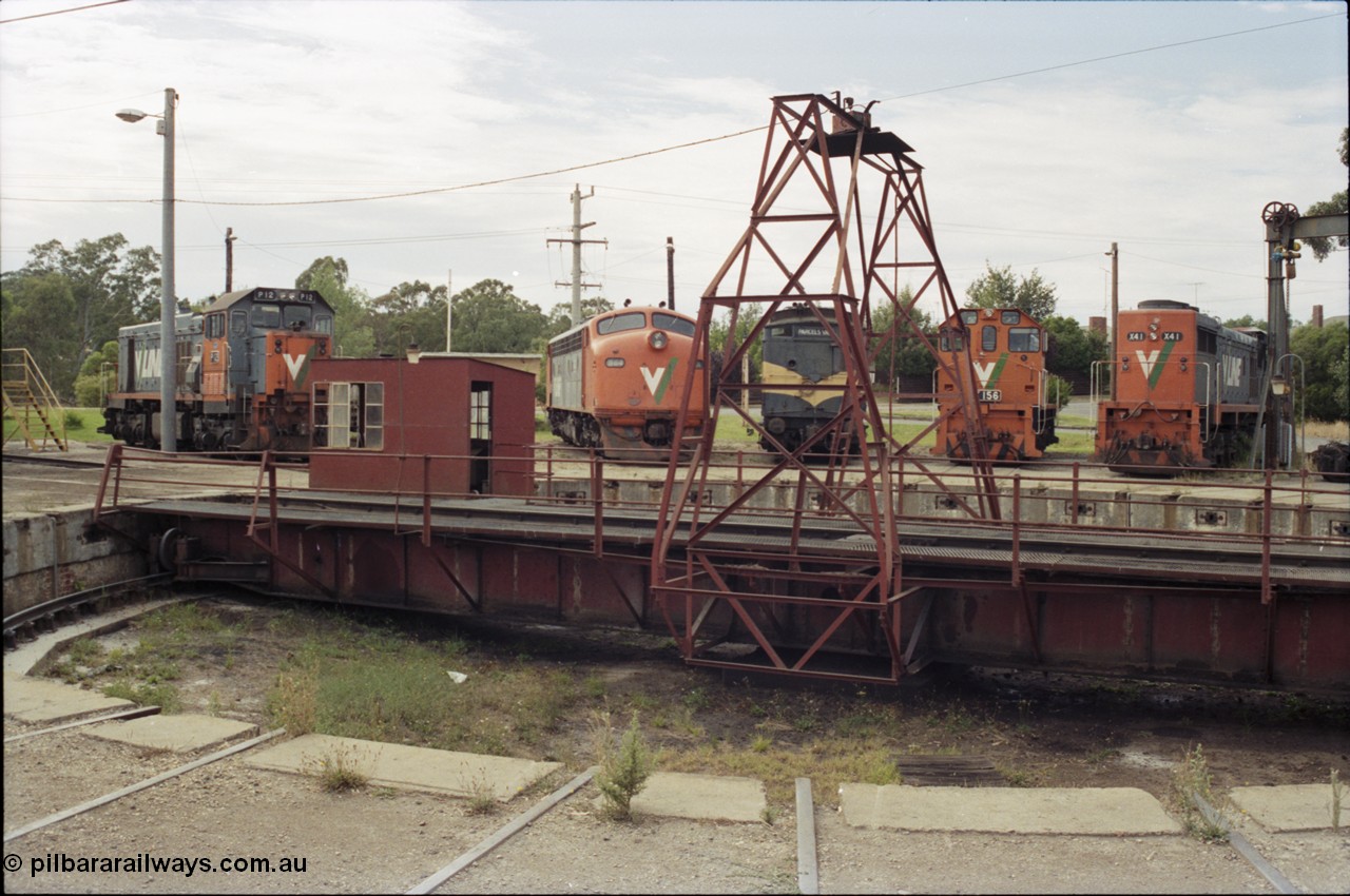 120-11
Seymour loco depot, turntable and pit, V/Line broad gauge locos, P class P 12 Clyde Engineering EMD model G18HBR serial 84-1206 rebuilt from T 329 Clyde Engineering EMD model G8B serial 56-82, B class B 64 Clyde Engineering EMD model ML2 serial ML2-5, CM class CM 3 parcels van, Y class Y 156 Clyde Engineering EMD model G6B serial 67-576 and X class X 41 Clyde Engineering EMD model G26C serial 70-704.
Keywords: P-class;P12;84-1206;Clyde-Engineering-Somerton-Victoria;EMD;G18HBR;