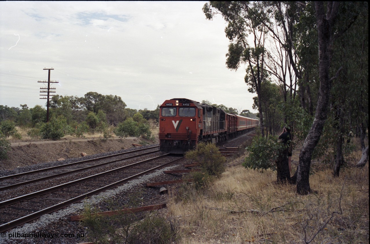 120-16
Seymour, V/Line broad gauge loco N class N 452 'Rural City of Wodonga' Clyde Engineering EMD model JT22HC-2 serial 85-1220, up Albury passenger train, north of Seymour, new sleepers on line.
Keywords: N-class;N452;Clyde-Engineering-Somerton-Victoria;EMD;JT22HC-2;85-1220;