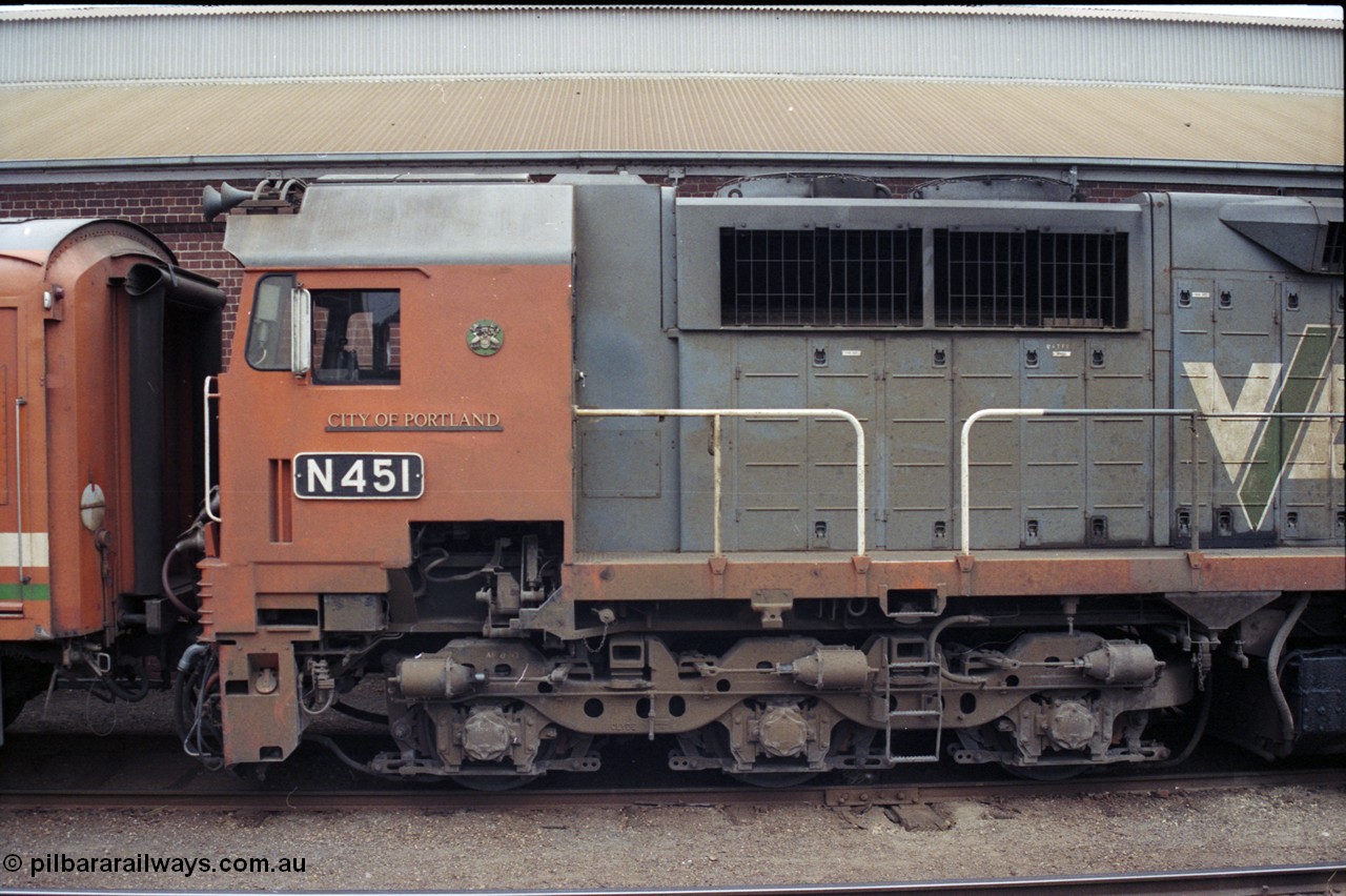 120-28
Wodonga station yard, stabled passenger train, V/Line broad gauge loco N class leader N 451 'City of Portland' Clyde Engineering EMD model JT22HC-2 serial 85-1219 and N set and D van next to the historic goods shed.
Keywords: N-class;N451;Clyde-Engineering-Somerton-Victoria;EMD;JT22HC-2;85-1219;