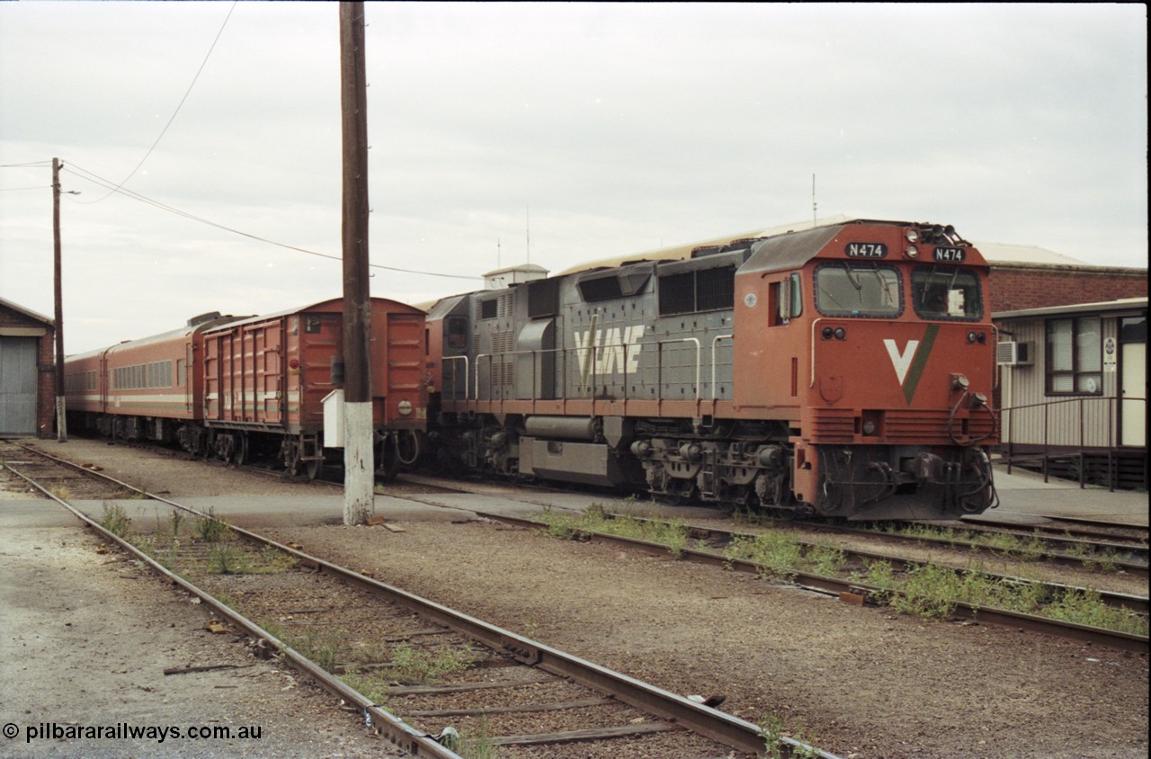 120-30
Wodonga yard, stabled passenger consists, V/Line broad gauge loco N class N 474 'City of Traralgon' Clyde Engineering EMD model JT22HC-2 serial 87-1203, next to a D van.
Keywords: N-class;N474;Clyde-Engineering-Somerton-Victoria;EMD;JT22HC-2;87-1203;