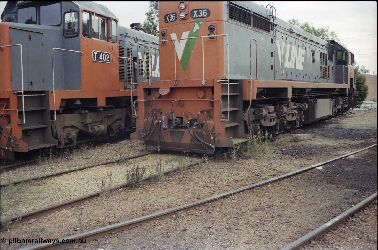 120-35
Wodonga loco depot, V/Line broad gauge loco X class X 36 Clyde Engineering EMD model G16C serial 66-489, showing pilot detail, T class T 402 cab side.
Keywords: X-class;X36;66-489;Clyde-Engineering-Granville-NSW;EMD;G16C;