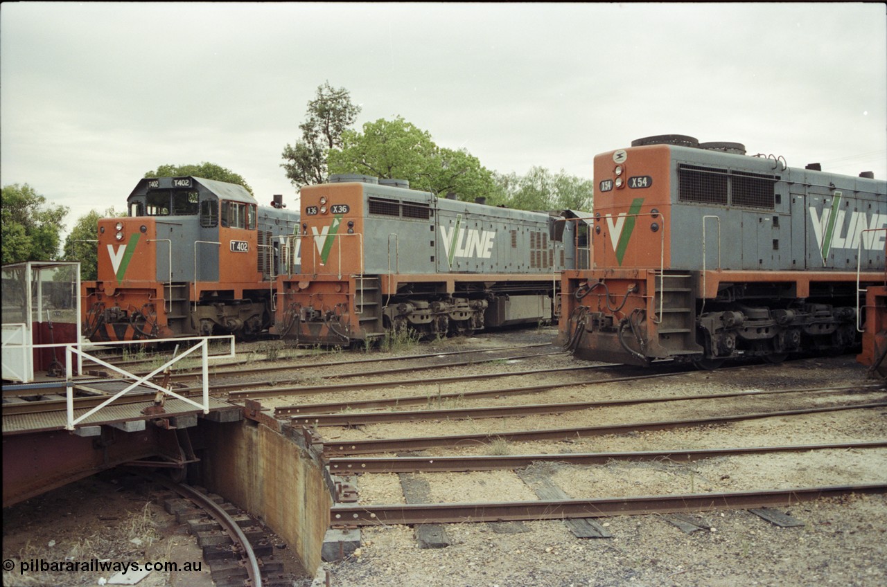 120-36
Wodonga loco depot turntable, pit, radial roads, V/Line broad gauge locos T class T 402 Clyde Engineering EMD model G18B serial 67-497, X class X 36 Clyde Engineering EMD model G16C serial 66-489, X class X 54 Clyde Engineering EMD model G26C serial 75-801, the differences between to the X class units are evident.
Keywords: X-class;X36;66-489;Clyde-Engineering-Granville-NSW;EMD;G16C;