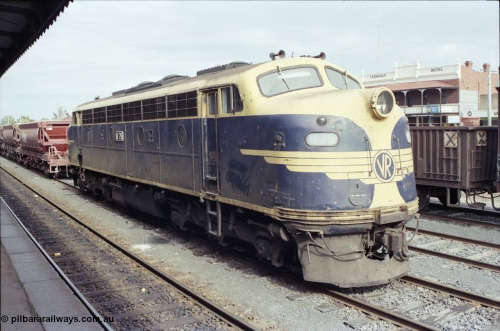 120-01
Seymour station platform, V/Line broad gauge Bulldog B class B 75 Clyde Engineering EMD model ML2 serial ML2-16 still in original Victorian Railways VR livery, ballast rake behind.
Keywords: B-class;B75;Clyde-Engineering-Granville-NSW;EMD;ML2;ML2-16;bulldog;