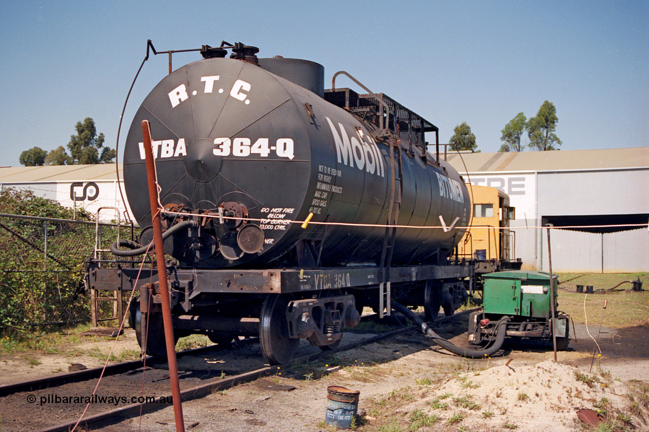 122-01
Morwell Industrial Estate siding, V/Line VTBA type bogie bitumen waggon VTBA 364, transfer trailer. VTBA 364 started life as OT type OT 364 built in August 1953 by Tulloch Ltd NSW as one of six 10,000 gallon (45.46 kL) Mobil bitumen tankers, recoded to TW 364 in October 1961, then in November 1979 to VTBA by Ballarat North Workshops.
Keywords: VTBA-type;VTBA364;Tulloch-Ltd-NSW;OT-type;TW-type;