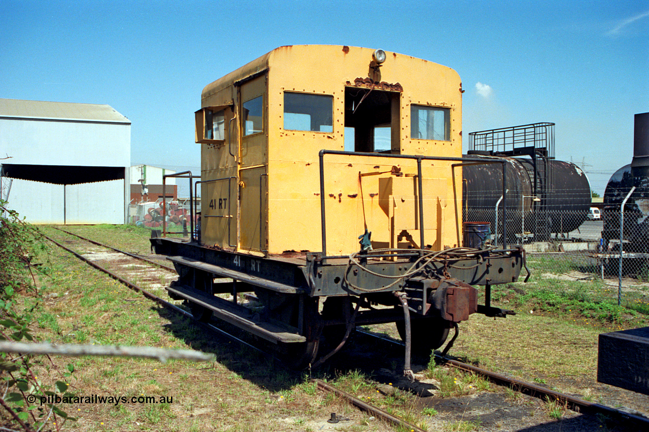 122-02
Morwell Industrial Estate siding, Victorian Railways yellow liveried rail tractor, RT class RT 41, bitumen storage tanks. RT 41 started life as I type waggon I 7565 from December 1905. Converted to IA type in the 1930s then in June 1967 it was converted by Ballarat North Workshops into the underframe for RT 41.
Keywords: RT-class;RT41;Victorian-Railways-Ballarat-Nth-WS;I-type;IA-type;I7565;IA7565