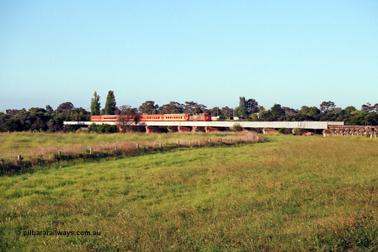 123-1-14
Avon River steel bridge, trestle bridge over flood plain at right, V/Line broad gauge N class N 451 'City of Portland' Clyde Engineering EMD model JT22HC-2 serial 85-1219 N set, up Bairnsdale pass, distant shot.
Keywords: N-class;N451;Clyde-Engineering-Somerton-Victoria;EMD;JT22HC-2;85-1219;