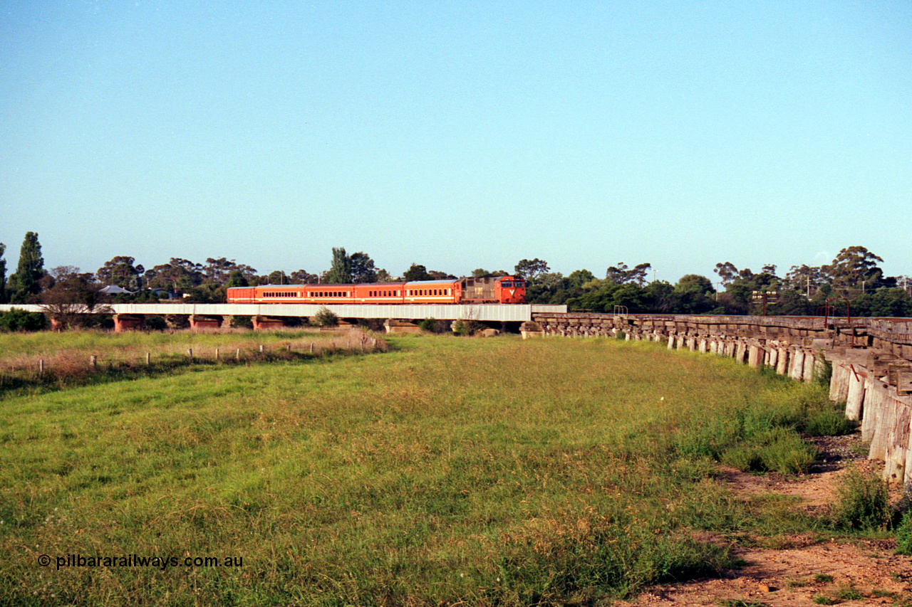 123-1-15
Avon River steel bridge, trestle bridge over flood plain at right, V/Line broad gauge N class N 451 'City of Portland' Clyde Engineering EMD model JT22HC-2 serial 85-1219 N set, up Bairnsdale pass, distant shot.
Keywords: N-class;N451;Clyde-Engineering-Somerton-Victoria;EMD;JT22HC-2;85-1219;