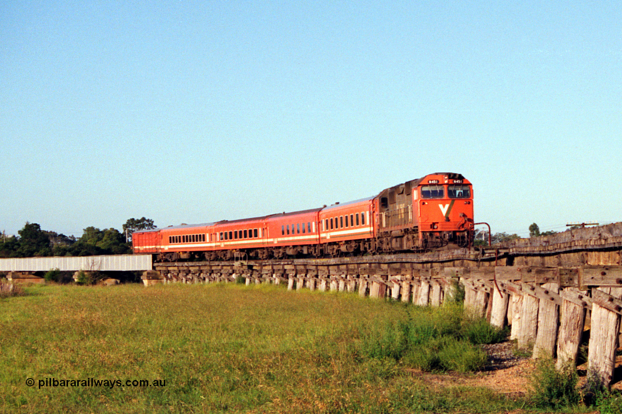 123-1-17
Avon River steel bridge, trestle bridge over flood plain at right, V/Line broad gauge N class N 451 'City of Portland' Clyde Engineering EMD model JT22HC-2 serial 85-1219 N set, up Bairnsdale pass.
Keywords: N-class;N451;Clyde-Engineering-Somerton-Victoria;EMD;JT22HC-2;85-1219;