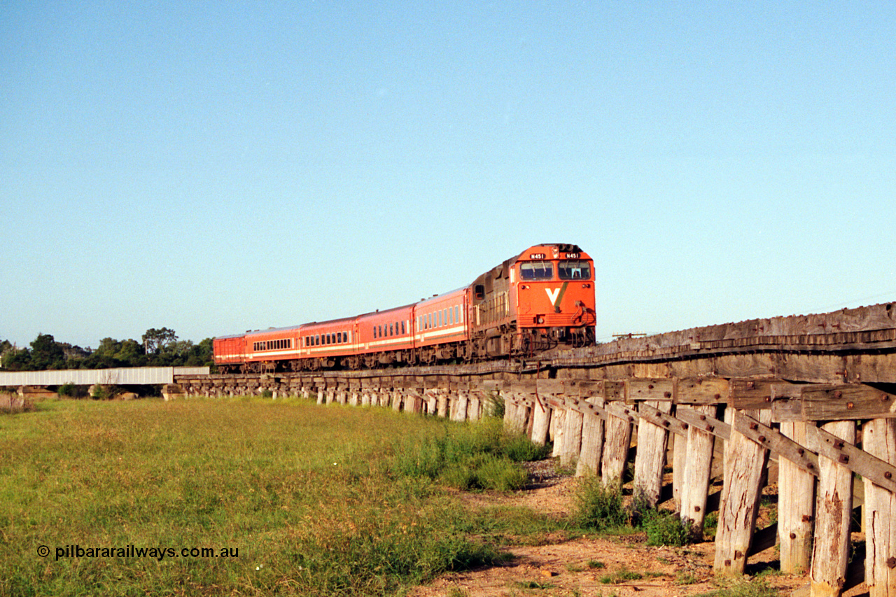 123-1-18
Avon River steel bridge, trestle bridge over flood plain at right, V/Line broad gauge N class N 451 'City of Portland' Clyde Engineering EMD model JT22HC-2 serial 85-1219, N set, up Bairnsdale pass.
Keywords: N-class;N451;Clyde-Engineering-Somerton-Victoria;EMD;JT22HC-2;85-1219;