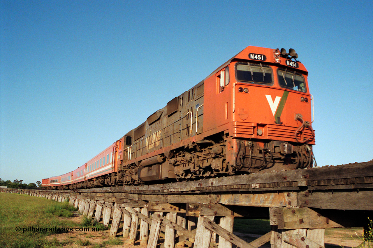 123-1-20
Avon River trestle bridge over flood plain, V/Line broad gauge N class N 451 'City of Portland' Clyde Engineering EMD model JT22HC-2 serial 85-1219, N set, up Bairnsdale pass.
Keywords: N-class;N451;Clyde-Engineering-Somerton-Victoria;EMD;JT22HC-2;85-1219;