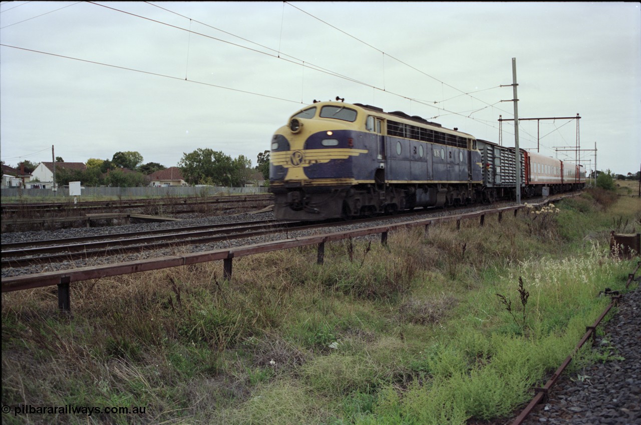 123-2-18
Sunshine V/Line broad gauge down passenger train with Victorian Railways liveried B class B 75 Clyde Engineering EMD model ML2 serial ML2-16, power van and N set.
Keywords: B-class;B75;Clyde-Engineering-Granville-NSW;EMD;ML2;ML2-16;bulldog;