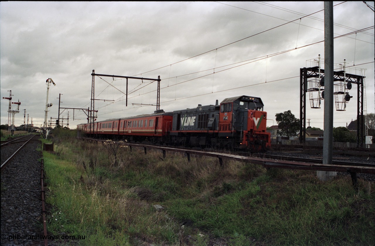 123-2-19
Sunshine V/Line broad gauge up passenger train with P class P 14 Clyde Engineering EMD model G18HBR serial 84-1208 rebuilt from First Series T class T 330 Clyde Engineering EMD model G8B serial 56-85, and H set, searchlight signal gantry on the right is for the standard gauge Sunshine Loop. Semaphore signal post 49 is pulled off for an up train on the Newport - Sunshine Loop Line on the left.
Keywords: P-class;P14;Clyde-Engineering-Somerton-Victoria;EMD;G18HBR;84-1208;rebuild;