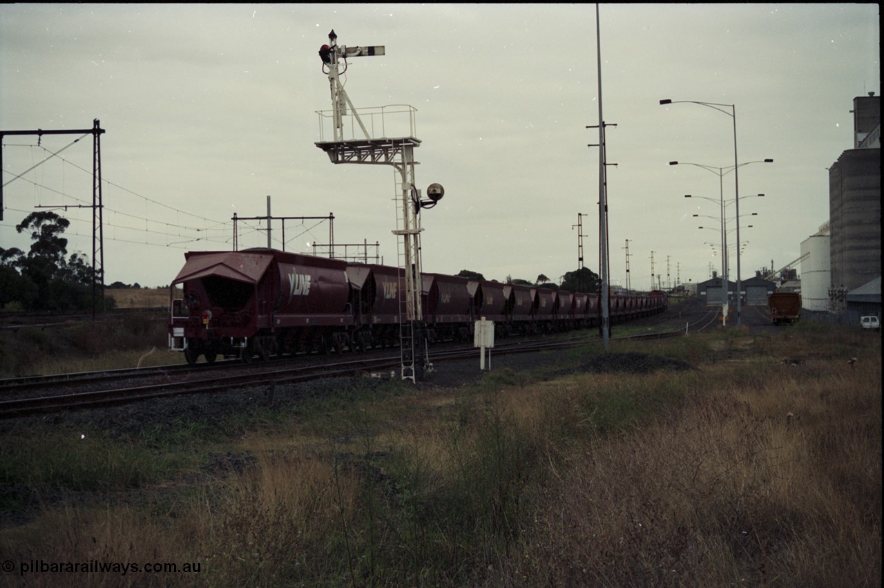 123-2-24
Sunshine track view, Newport - Sunshine Loop Line, looking towards Newport, GEB Sidings on the right, semaphore signal post 50 protecting down movements, V/Line broad gauge G class G 543, the last unit of Clyde Engineering EMD model JT26C-2SS serial 89-1276 with an loaded up Apex quarry train bound for Brooklyn, trailing shot.
Keywords: G-class;G543;Clyde-Engineering-Somerton-Victoria;EMD;JT26C-2SS;89-1276;