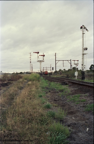 123-2-20
Sunshine track view, Newport - Sunshine Loop Line, looking towards Sunshine, double doll semaphore signal posts 36 and pulled off semaphore signal post 49, G class arriving with an up Brooklyn bound Apex quarry train.
