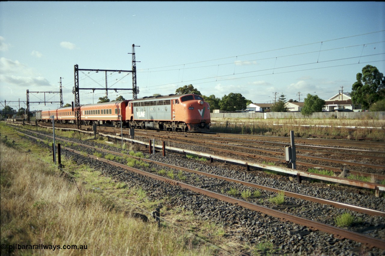 124-04
Sunshine V/Line broad gauge B class B 76 Clyde Engineering EMD model ML2 serial ML2-17 with an up passenger train of N set and PH power van at the 8 km post.
Keywords: B-class;B76;Clyde-Engineering-Granville-NSW;EMD;ML2;ML2-17;bulldog;